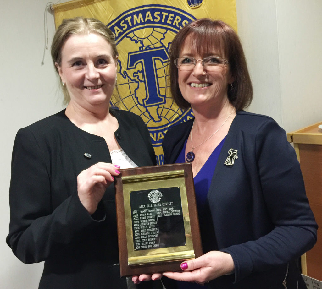 Carole Cafferky being presented with her trophy by Contest Chair Laura Costello.